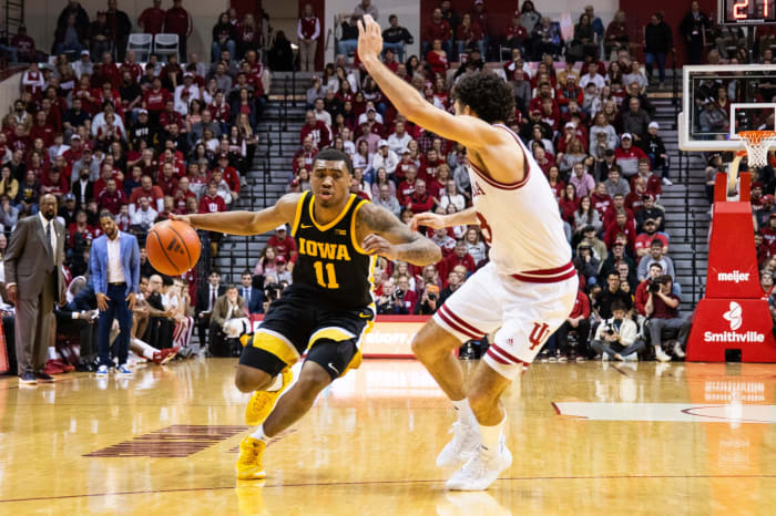 Iowa Hawkeyes guard Tony Perkins (11) dribbles the ball while Indiana Hoosiers guard Trey Galloway (32) defends in the second half at Simon Skjodt Assembly Hall.